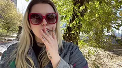 BEAUTIFUL SLAVIC BLONDE GODDESS SMOKING CIGARETTE OUTDOORS IN A PRETTY FALL LANDSCAPE